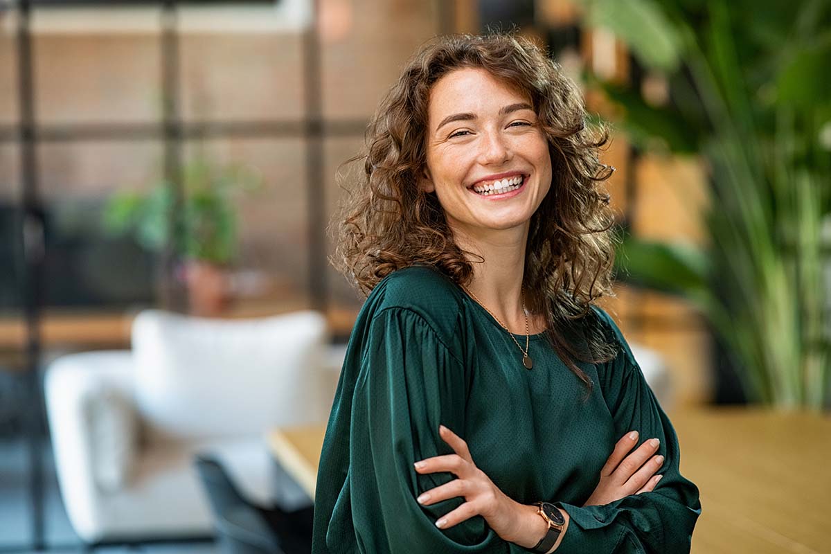 Woman standing with crossed hands after learning about dopamine and foods