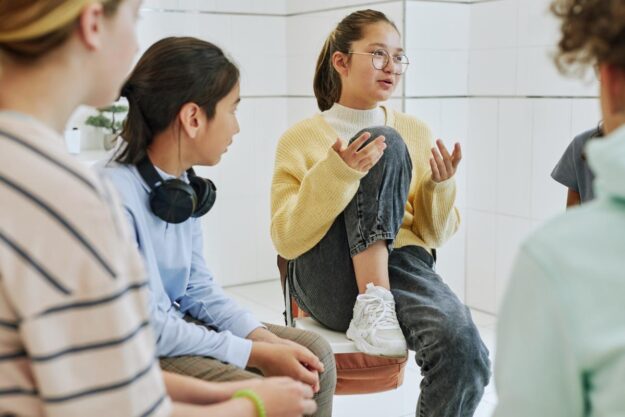 3 Benefits of IOP Woman sits on chair and discusses benefits of an IOP