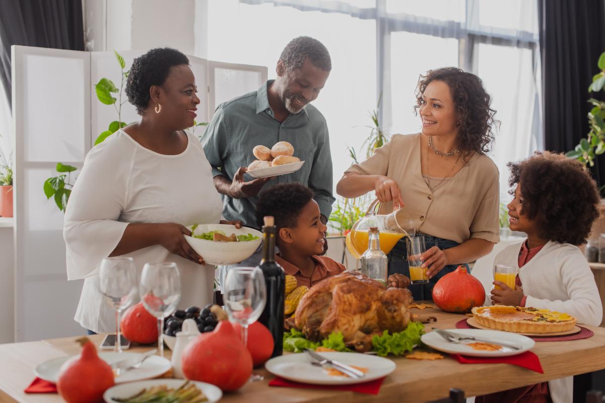 Relatives laugh and bond after setting healthy boundaries with family for Thanksgiving