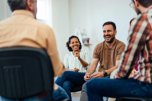 Benefits of Group Therapy for Anxiety People bond and laugh during a wonderful social anxiety group therapy