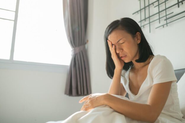 Bulimic Teeth The Dangers of Bulimia Woman puts face in hand as she wonders if she has developed bulimic teeth