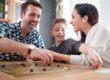 Family laughs and bonds while engaging in family therapy games