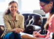 Therapist takes notes while talking to patient about mental health resources in Texarkana