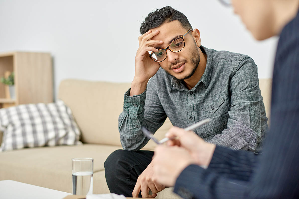 Transfer Addiction- What Is It and What to Do About It Man listens as therapist talks to him about transfer addictions
