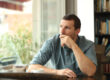 Man sits and ponders if he is a functioning alcoholic