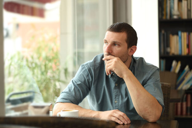 Are You a Functioning Alcoholic Man sits and ponders if he is a functioning alcoholic