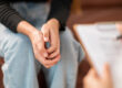 Woman sits and talks to therapist about medication management